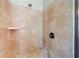 Tile shower featuring bronze fixtures and built-in bench at 390 Scott Farm Dr, Powder Springs, GA 30127