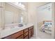 Bathroom featuring a dual vanity and views into a bedroom at 390 Scott Farm Dr, Powder Springs, GA 30127