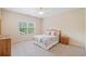 Cozy bedroom with a large window and light-colored walls, ideal for relaxation and restful nights at 390 Scott Farm Dr, Powder Springs, GA 30127