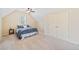 Bright bedroom features neutral walls and plush carpeting at 390 Scott Farm Dr, Powder Springs, GA 30127