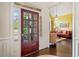 Elegant foyer featuring hardwood floors with a view into the bright, stylish living room at 390 Scott Farm Dr, Powder Springs, GA 30127