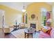 Cozy living room boasting fireplace, vaulted ceiling, and bright windows for natural light at 390 Scott Farm Dr, Powder Springs, GA 30127