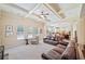 Spacious living room featuring a coffered ceiling, plush seating, and open floor plan at 390 Scott Farm Dr, Powder Springs, GA 30127