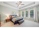 Tranquil main bedroom features tray ceiling, large windows, and neutral decor at 390 Scott Farm Dr, Powder Springs, GA 30127