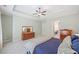 Spacious main bedroom features tray ceilings, ceiling fan, and neutral color palette, perfect for relaxation and comfort at 390 Scott Farm Dr, Powder Springs, GA 30127