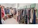 Large walk-in closet provides ample storage with shelving, hanging rods, and room for shoes, clothes, and accessories at 390 Scott Farm Dr, Powder Springs, GA 30127