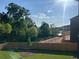 Home with a fenced backyard near lakefront property with scenic views at 4010 Sierra Knolls Ct, Cumming, GA 30040