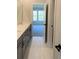Bathroom with dual sinks, vanity, and an open doorway to bedroom at 4010 Sierra Knolls Ct, Cumming, GA 30040