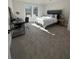 Cozy bedroom with a comfortable bed, desk, and natural light at 4010 Sierra Knolls Ct, Cumming, GA 30040