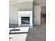 Cozy living room featuring a modern fireplace and plush carpeting at 4010 Sierra Knolls Ct, Cumming, GA 30040