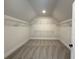 Well-organized walk-in closet with ample shelving and storage space at 4010 Sierra Knolls Ct, Cumming, GA 30040