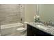 Bathroom featuring granite counters, tub, and shower at 4050 Sierra Vista Cir, Cumming, GA 30040
