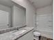 Bathroom featuring granite counters, tub, and shower at 4050 Sierra Vista Cir, Cumming, GA 30040