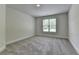 Bright bedroom with neutral carpet and window at 4050 Sierra Vista Cir, Cumming, GA 30040
