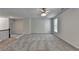 Spacious loft area with neutral paint and plush carpeting, bathed in natural light at 4050 Sierra Vista Cir, Cumming, GA 30040