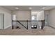 Loft with black iron railing overlooking the entrance at 4050 Sierra Vista Cir, Cumming, GA 30040