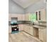 Open kitchen with new stainless steel appliances, ample counter space and new cabinets at 201 Deerfield Ln, Carrollton, GA 30116