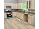 Open kitchen with new stainless steel appliances, ample counter space and new cabinets at 201 Deerfield Ln, Carrollton, GA 30116