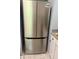 New stainless steel refrigerator with side-by-side doors complements this modern kitchen with a contemporary design at 201 Deerfield Ln, Carrollton, GA 30116