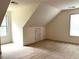 Upstairs room with windows offering natural light and carpet floors at 300 Gaelic Way, Tyrone, GA 30290