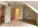 View of carpeted bedroom featuring walk-in closets and access to the bathroom at 300 Gaelic Way, Tyrone, GA 30290