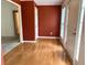 Foyer with hardwood floors, warm-toned walls, and white trim, offering a welcoming entrance at 300 Gaelic Way, Tyrone, GA 30290
