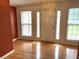 Beautiful foyer featuring hardwood floors, natural light from large windows, and traditional trim at 300 Gaelic Way, Tyrone, GA 30290