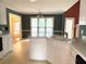Eat-in kitchen with white cabinets, lots of countertop space, and a view to other rooms at 300 Gaelic Way, Tyrone, GA 30290