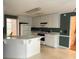 Updated kitchen featuring white cabinets, tile floors, and modern appliances at 300 Gaelic Way, Tyrone, GA 30290