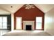 Bright living room with cathedral ceiling, fireplace, fresh paint, and carpet floors at 300 Gaelic Way, Tyrone, GA 30290