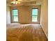 Spacious main bedroom with carpeted floor and natural light streaming through the windows at 300 Gaelic Way, Tyrone, GA 30290