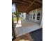 Covered back patio with stained concrete and multiple windows offering ample natural light at 312 Archway Ln, Peachtree City, GA 30269