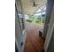 Covered back porch with wood flooring, ceiling fan and neighborhood views at 312 Archway Ln, Peachtree City, GA 30269