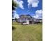 Spacious backyard featuring lush green grass, covered deck, and walkout basement at 312 Archway Ln, Peachtree City, GA 30269