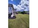 Spacious backyard featuring lush green grass, covered deck, and walkout basement at 312 Archway Ln, Peachtree City, GA 30269