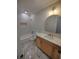 Bathroom with marble floors, modern vanity, and tiled walls at 312 Archway Ln, Peachtree City, GA 30269