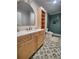 Bathroom features a stylish vanity, beautiful shower with green tile, and patterned floor at 312 Archway Ln, Peachtree City, GA 30269