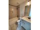 Bright bathroom featuring a shower-tub, tile floor, and white vanity at 312 Archway Ln, Peachtree City, GA 30269