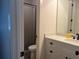 Cozy bathroom featuring a shower with curtain, toilet, and vanity with drawers at 312 Archway Ln, Peachtree City, GA 30269