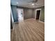 Spacious bedroom features a ceiling fan, wood-look flooring, and modern trim at 312 Archway Ln, Peachtree City, GA 30269