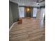 Spacious bedroom with wood-look flooring, recessed lighting, and natural light from windows at 312 Archway Ln, Peachtree City, GA 30269