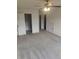Bedroom with large closet and full bathroom features neutral paint and carpet at 312 Archway Ln, Peachtree City, GA 30269
