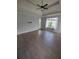 Spacious primary bedroom with hardwood floors, tray ceilings, neutral paint, and abundant natural light at 312 Archway Ln, Peachtree City, GA 30269
