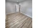 A cozy bedroom with hardwood floors, white trim, and a view into another room at 312 Archway Ln, Peachtree City, GA 30269