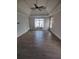 Spacious primary bedroom with hardwood floors, tray ceilings, neutral paint, and abundant natural light at 312 Archway Ln, Peachtree City, GA 30269