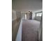 Upstairs bonus room featuring neutral carpet and ceiling fan at 312 Archway Ln, Peachtree City, GA 30269
