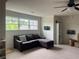 Spacious bonus room with a large window, comfortable seating, and neutral carpeted flooring at 312 Archway Ln, Peachtree City, GA 30269