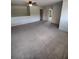 Large bonus room with ceiling fan, neutral carpet and easy access to multiple rooms at 312 Archway Ln, Peachtree City, GA 30269