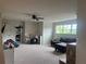 Large bonus room with carpeted floors, a sofa, and playroom area with storage at 312 Archway Ln, Peachtree City, GA 30269