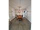 Bright dining room featuring a modern chandelier and light wood floors at 312 Archway Ln, Peachtree City, GA 30269